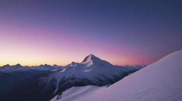 Snowy Mountain Range at Dusk with Vibrant Sky and Alpine Glow photo
