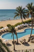 Tropical Beach Resort with Poolside Lounges and Palm Trees photo