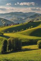 Rolling Green Hills Landscape with Village and Distant Mountains Scenery photo