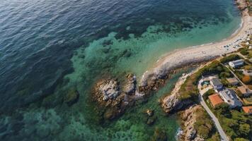 Aerial View of Coastline with Clear Water and Beach in Summer photo
