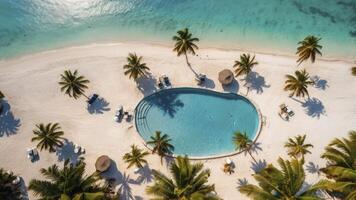 Aerial View of Tropical Resort with Pool Palm Trees and Sandy Beach photo