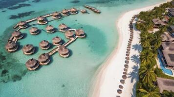 Aerial View of Luxury Overwater Bungalows at Tropical Beach Resort photo