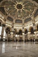 Interior View of Grand Mosque with Decorated Ceiling and Marble Floor photo