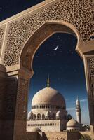 Mosque View Through Ornate Archway Under Night Sky with Crescent Moon photo