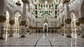 Exploring Grand Mosque Interior with Arches, Columns, and Marble Floor photo