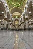 Exploring a Grand Mosque Interior with Marble Floor and Arches photo