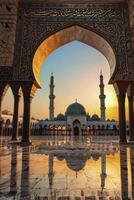 Viewing Mosque Through Archway at Sunset with Reflection and Arabic Script photo