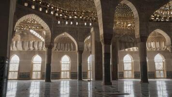 Exploring Grand Mosque Architecture with Arches, Columns, and Interior Light photo