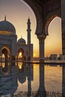 Sheikh Zayed Grand Mosque Architecture with Reflection During Golden Sunset photo