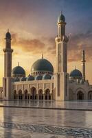 Magnificent Mosque Exterior at Sunset with Golden Sky and Reflections photo