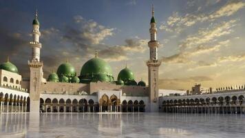 Prophet's Mosque in Medina with Green Dome Under Cloudy Sky at Sunset photo