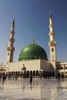 Green Dome of the Prophet's Mosque in Medina with Clear Sky photo