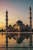 Mosque Reflection at Sunset with Minarets and Golden Sky Landscape photo