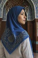 Woman Wearing Hijab in Mosque Looking Away Serene and Contemplative photo