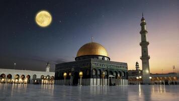 The moon is shining over the dome of the mosque photo
