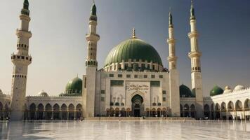 Exterior View of Masjid an Nabawi with Its Minarets and Green Domes photo