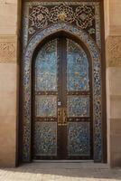 Elaborate Entrance Door with Islamic Style Decorations and Intricate Patterns photo