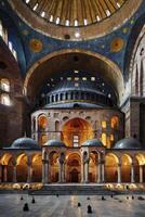 Exploring Ancient Church Interior with Dome and Architectural Grandeur photo