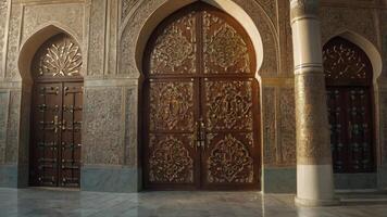 Ornate Wooden Doors with Carvings and Arches in Middle Eastern Architecture photo