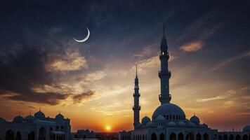 Mosque Silhouette at Dusk with Crescent Moon in a Colorful Sky photo