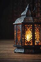 Illuminated Lantern with Candlelight on Wooden Surface Creating a Warm Ambiance photo