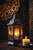 Illuminated Lantern and Candle Creating a Warm Festive Atmosphere photo