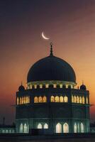 Mosque Illuminated at Dusk with Crescent Moon in the Sky photo