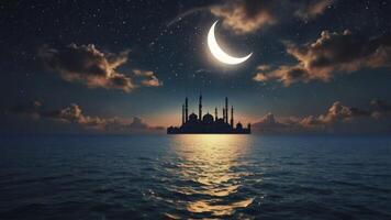 Mosque Silhouette Shines Under Crescent Moon Over Calm Water at Night photo