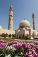 Muscat Sultan Qaboos Grand Mosque with Tower and Flower Garden photo