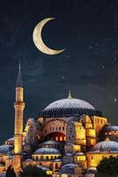 The blue mosque in istanbul, turkey, with a crescent moon in the sky photo