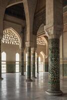 Exploring Moorish Architecture Interior with Arches Columns and Intricate Tilework photo
