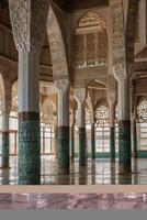 Exploring Decorative Interior of Hassan Ii Mosque with Ornate Columns and Arches photo