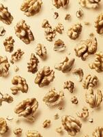 Scattered Walnut Pieces on Beige Background Overhead Food Photography Style photo