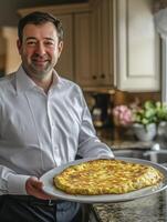 Smiling Man Holding Omelette on Plate in Kitchen Environment photo