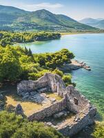 Exploring Ancient Stone Ruins Overlooking Calm Turquoise Waters and Lush Greenery photo