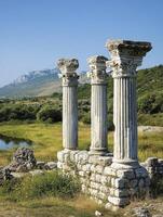 Exploring Ancient Ruins Three Corinthian Columns at Butrint National Park photo