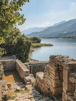 Exploring Ancient Ruins Overlooking Lake Skadar with Mountains in Montenegro photo