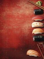 Assorted Sushi Plate with Chopsticks on Rustic Red Textured Background photo