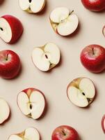 Scattered Red Apples and Halves on Beige Background Fruit Pattern photo