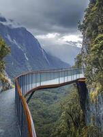 Walking Along Cliffside Overlook with Mountain Views and Forest in Background photo
