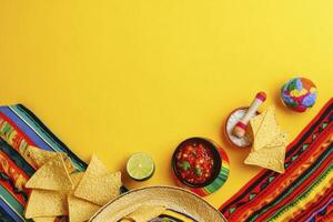 Arrangement of Colorful Mexican Party Objects Against a Vibrant Yellow Backdrop photo