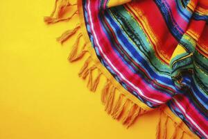 Vibrant Striped Blanket with Yellow Tassels on Sunny Background photo