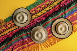 Arrangement of Summer Hats and Colorful Woven Blanket on Yellow Surface photo