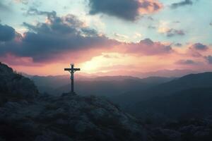 Cross on Mountain Top with Sunset Sky Religious Easter Symbol photo