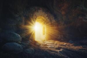 Exploring Cave Opening with Sunlight Shining Through Ancient Stone Archway photo