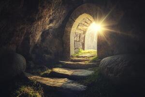 Exploring Ancient Stone Archway with Steps Leading to Bright Sunlight photo