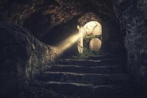 Stone Steps Ascending From Dark Cave to Light in Dramatic Scene photo