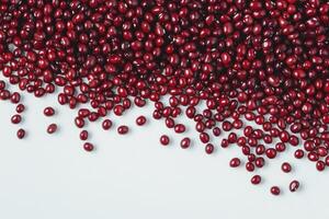 Red Adzuki Bean Scattering on White Background for Healthy Eating photo