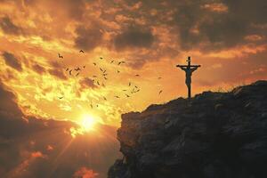 silueta de crucifijo en acantilado a puesta de sol con aves volador foto