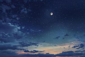 Looking Up at Night Sky with Stars and Moon Above Clouds photo